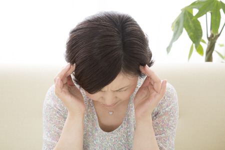 Middle woman for pressing the headの写真素材