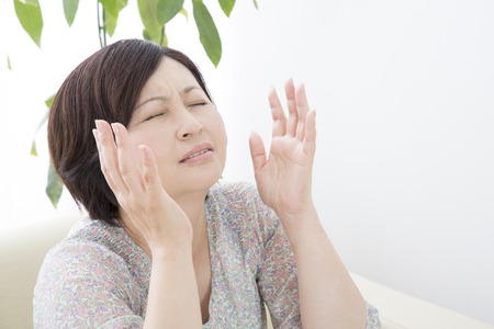 Middle woman pointing the skyの写真素材