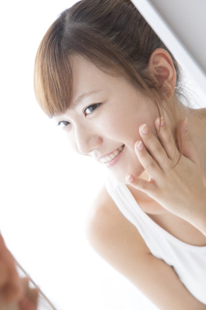 Woman to check your skinの写真素材