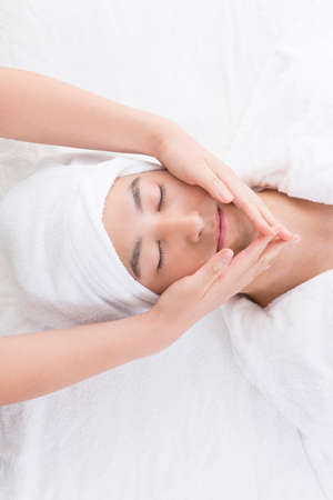 Men get a face massageの写真素材