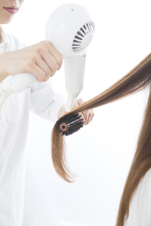 Hairdresser to the hair setの写真素材