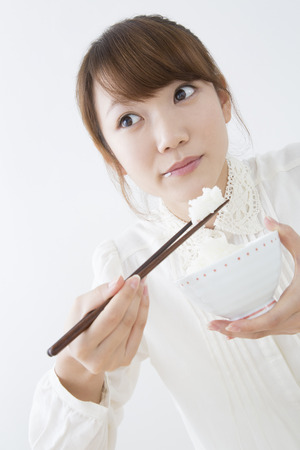 Women to eat riceの写真素材