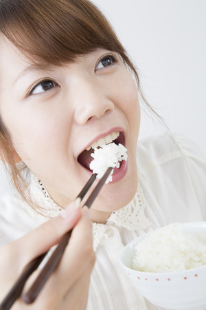 Women to eat riceの写真素材