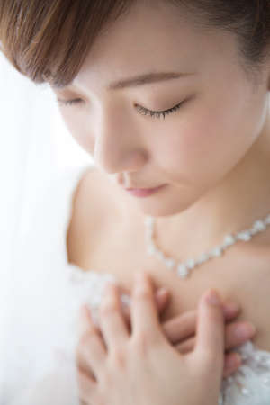 Bride holding breastの写真素材