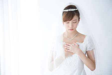 Bride holding breastの写真素材