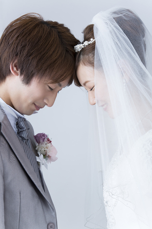 Bride and groom to match the foreheadの写真素材