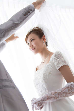 Bride and groom veil upの写真素材