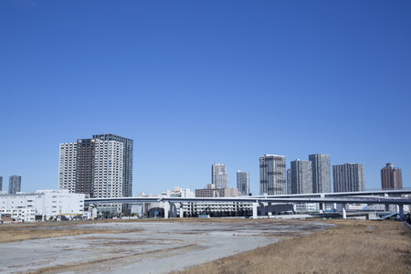 Vacant land and skyscrapers