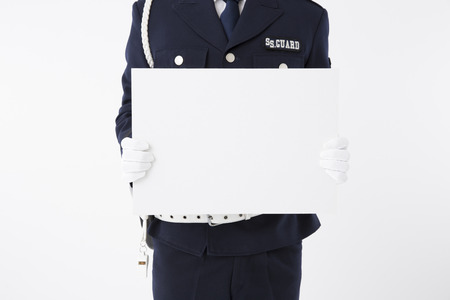 Security guard with a message boardの写真素材