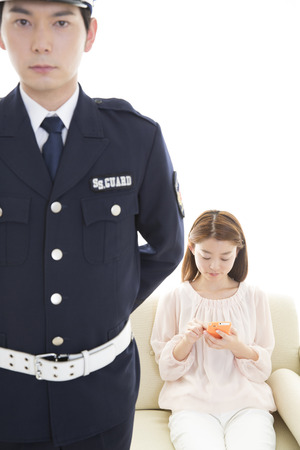 Security guards protect the womanの写真素材