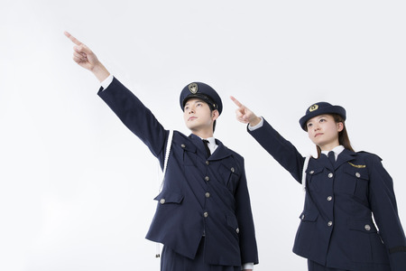 Police officers and pointing at the far