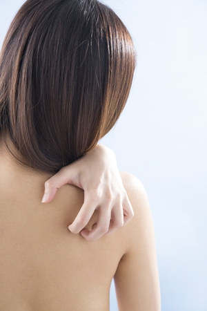 Women scratching backの写真素材