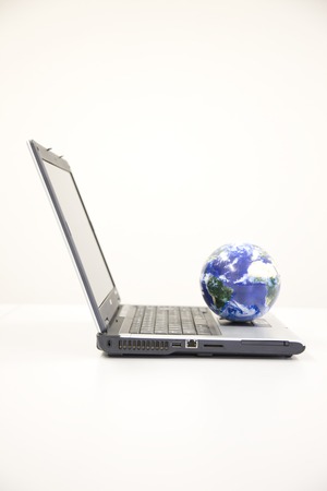 Globe and notebook computerの写真素材