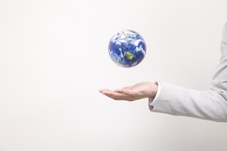 Hands of the globe and a businessmanの写真素材