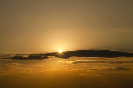 Likely setting sun hidden by clouds