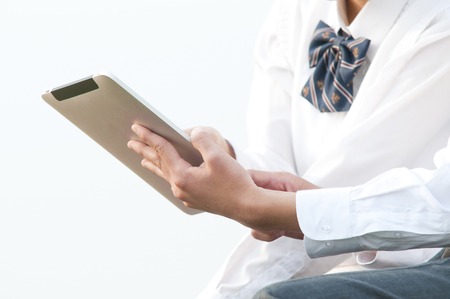 High school couple with tablet PCの写真素材