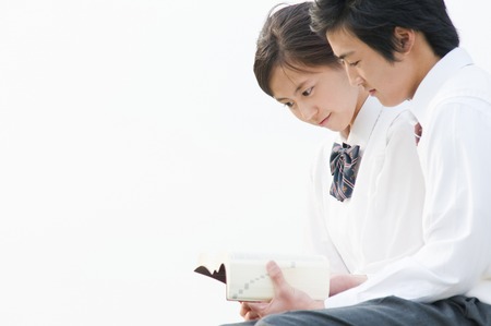High school couple Read thisの写真素材