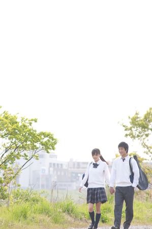 High school a couple walking a riverbedの写真素材