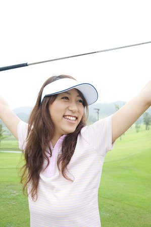 Woman to the growth with a driverの写真素材