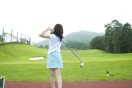 Women in golf practiceの写真素材