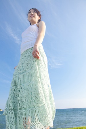 Woman standing on the hillの写真素材