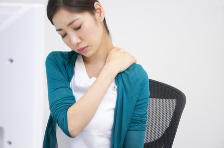 OL suffering from a stiff neckの写真素材