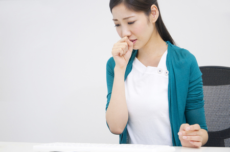 OL to coughの写真素材