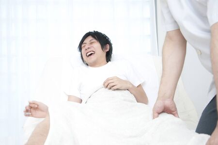 Men who complain of pain in response to the manipulativeの写真素材