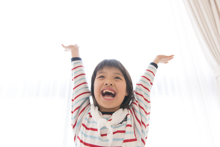 Girl smile by taking a handsの写真素材