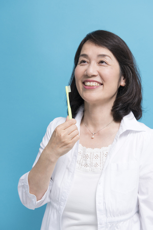 Senior woman with a toothbrushの写真素材