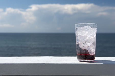 Blue sky and Cassis sodaの写真素材