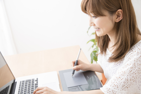 Women using the pen tabletの写真素材