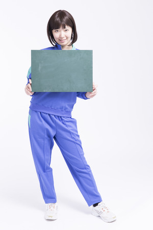 High school girl with a message boardの写真素材