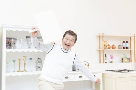 Senior men with a message boardの写真素材