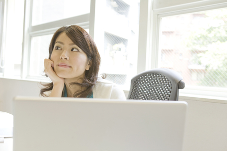 Women trying to thinkの写真素材