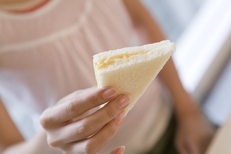 Hand with a sandwichの写真素材