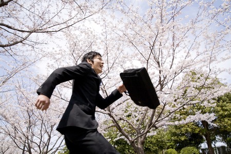 Businessman to run the cherry backの写真素材