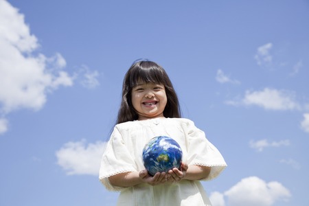 Girl with globeの写真素材