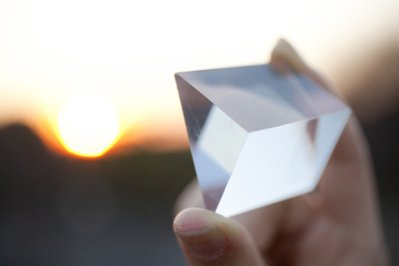 Hand of a woman with a prismの写真素材