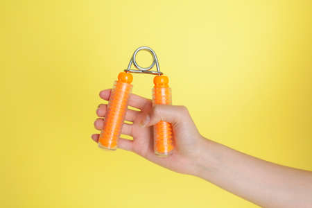 Hand of the woman holding the hand clipの写真素材