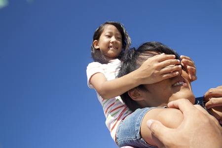 Girl to blindfold his fatherの写真素材
