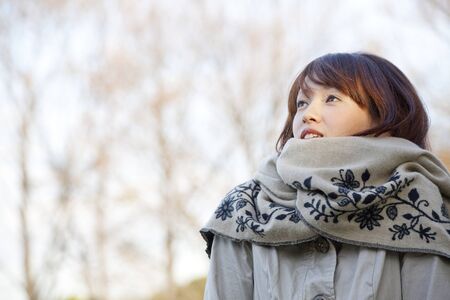 Women smile staring into the distanceの写真素材