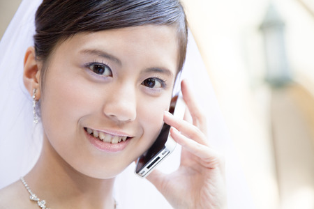 Bride to call a smartphoneの写真素材