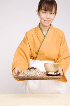 Bring to the table a woman clerkの写真素材