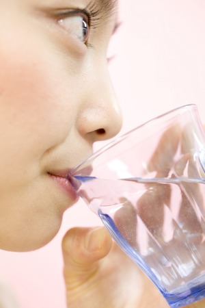 Woman drinking waterの写真素材