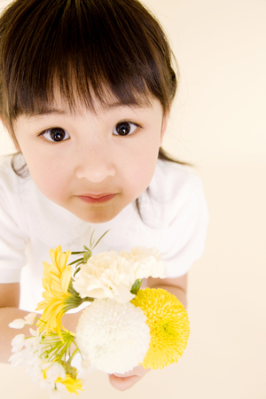 Children with flowersの写真素材