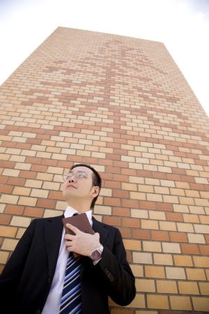 Businessman to lean against the wallの写真素材