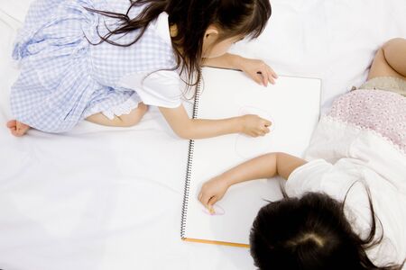 Two girls to the paintingの写真素材