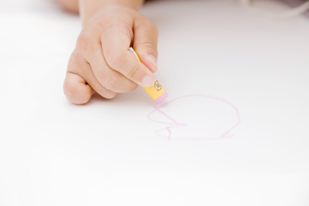 Hand of the girl to the paintingの写真素材