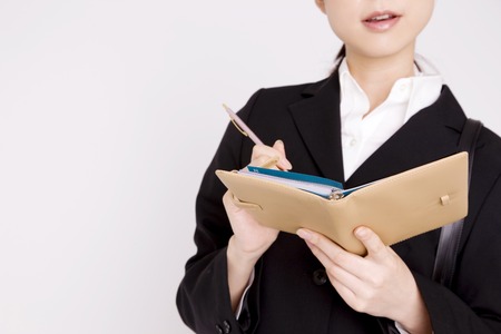 Women who notes in a notebookの写真素材